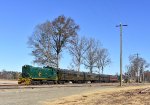 The diesel consist heads away from the photographers toward the S. Woodstown Station while a car on parallel Woodstown Alloway Rd outpaces the train. 